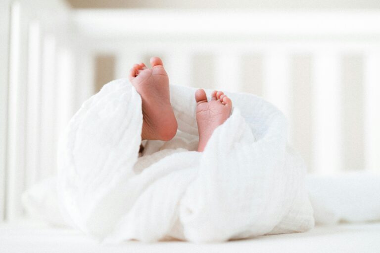 Baby feet wrapped up in a muslin