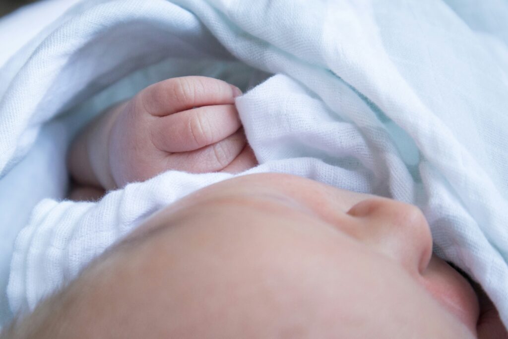 A swaddled baby - large muslins are perfect for this.